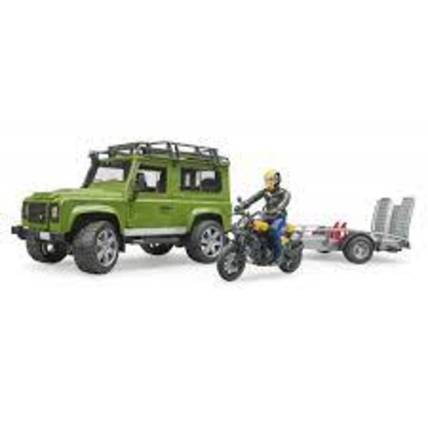 Land Rover Defender z przyczepą i motocyklem
